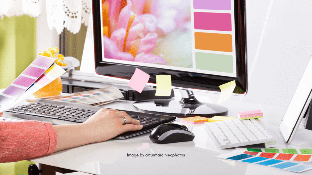 Woman typing on desktop computer - and building a website based on color palette